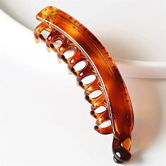 Frosted solid color banana hair clips for women and girls in navy, green, and black